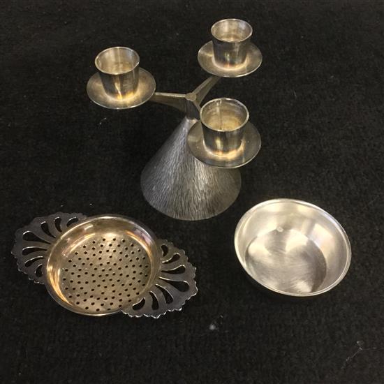 Silver tea strainer and a silver 3 branch candelabrum